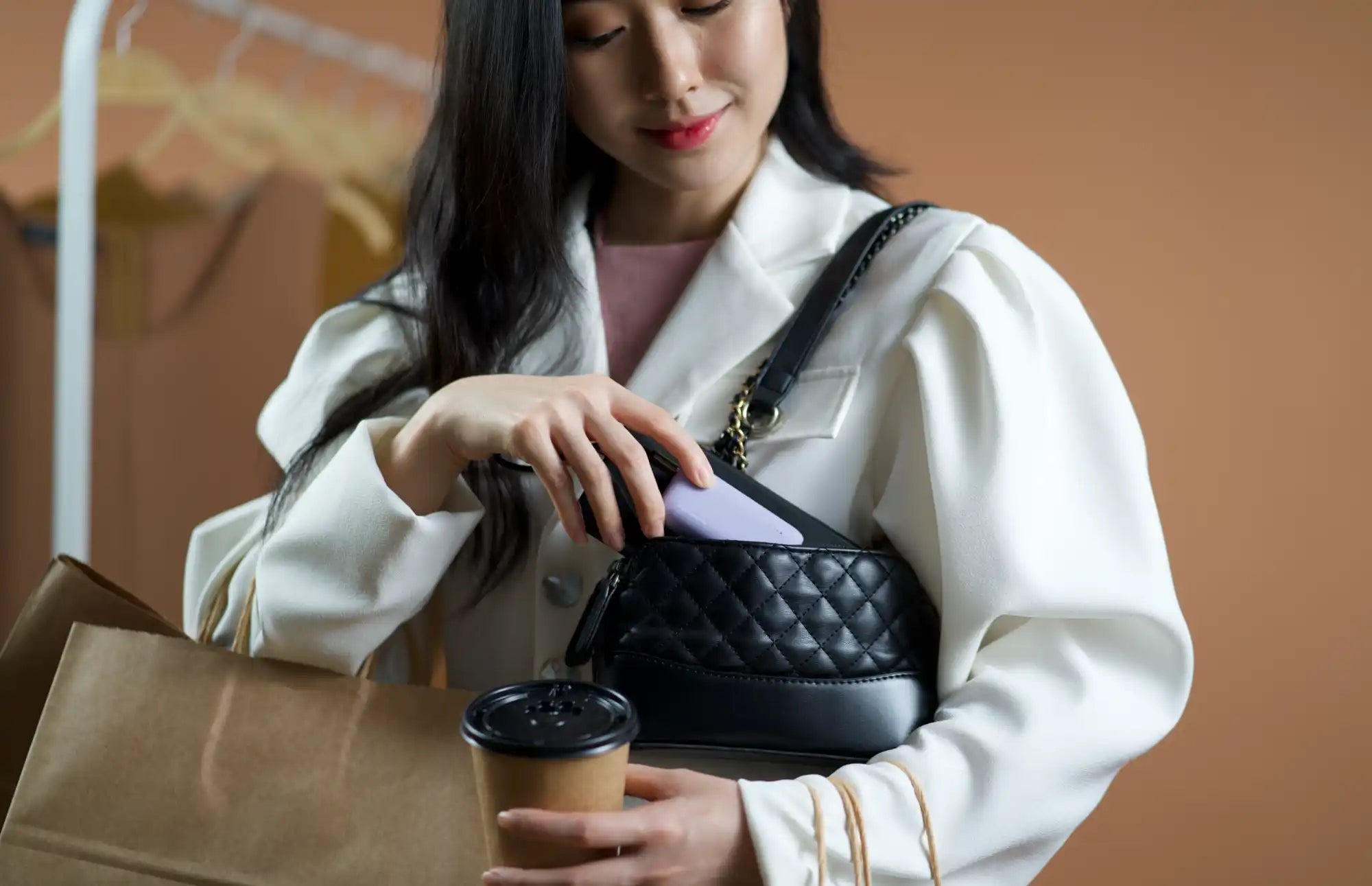 Black quilted handbag.