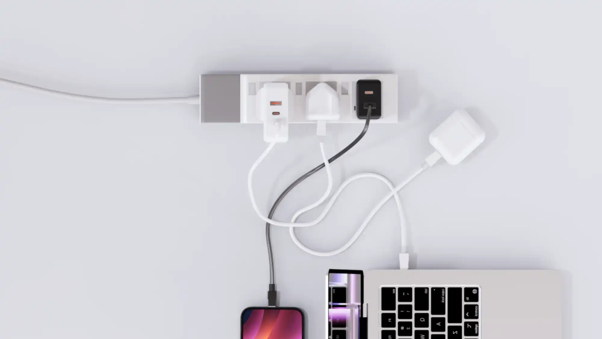 Charging devices plugged into a power strip.