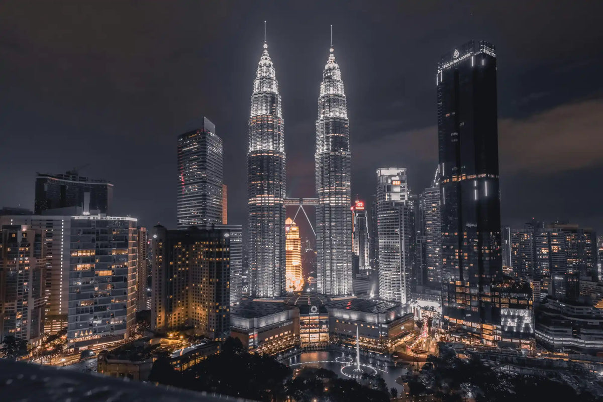 Illuminated Kuala Lumpur skyline.
