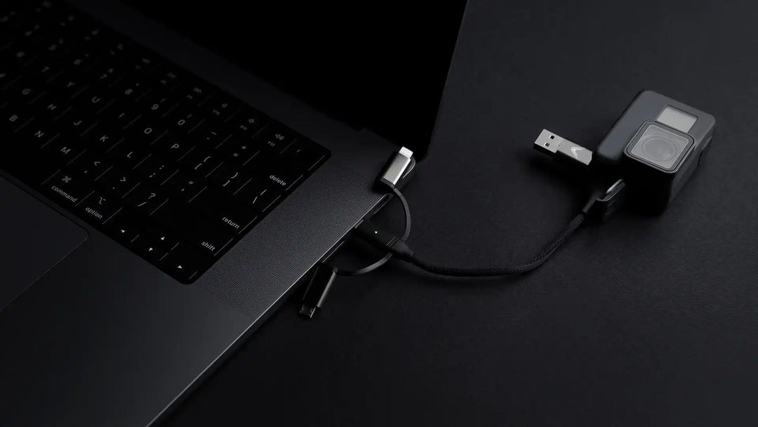 Laptop connected to a multi-port adapter.