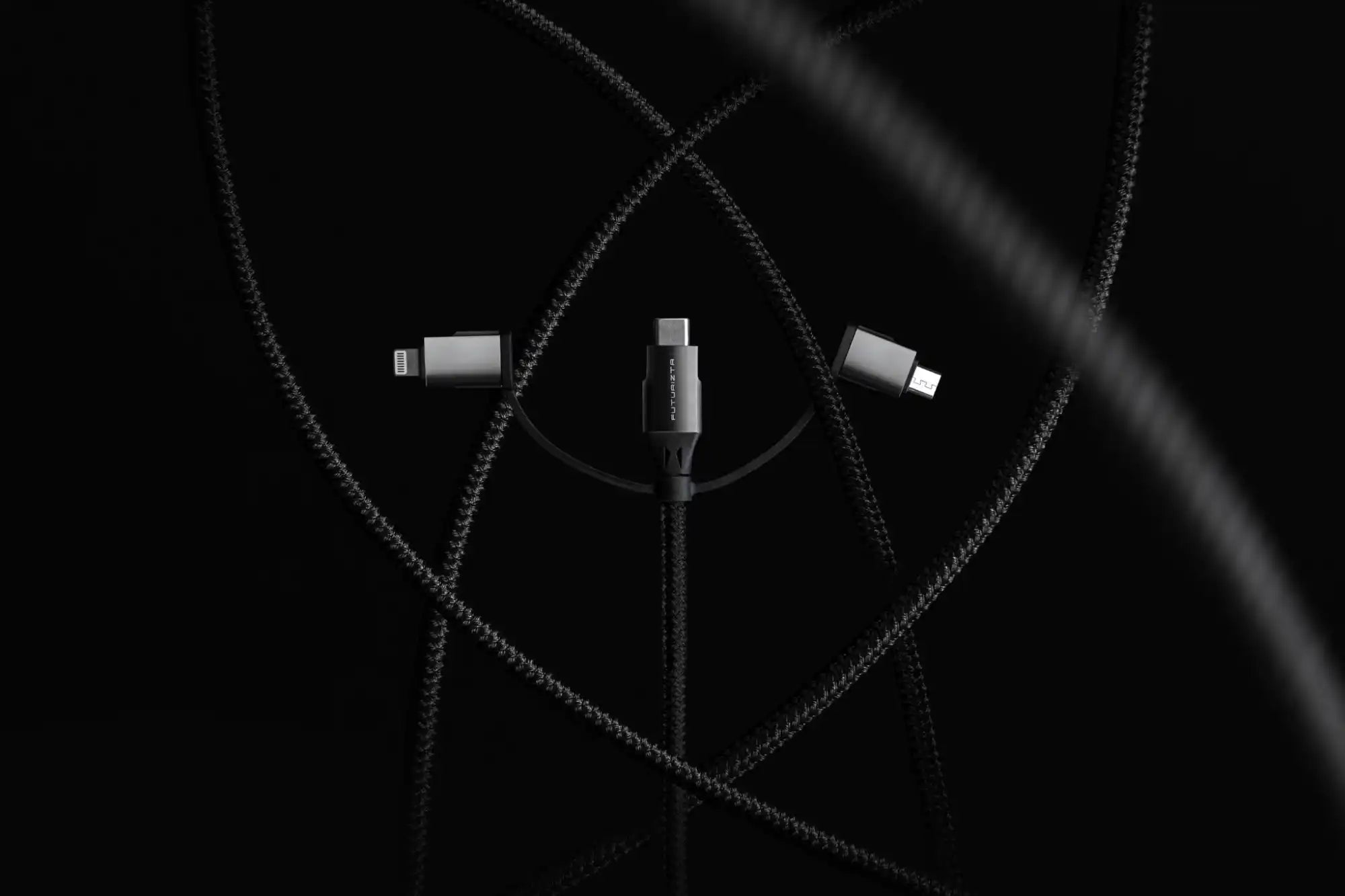 Braided charging cable with multiple connector types.
