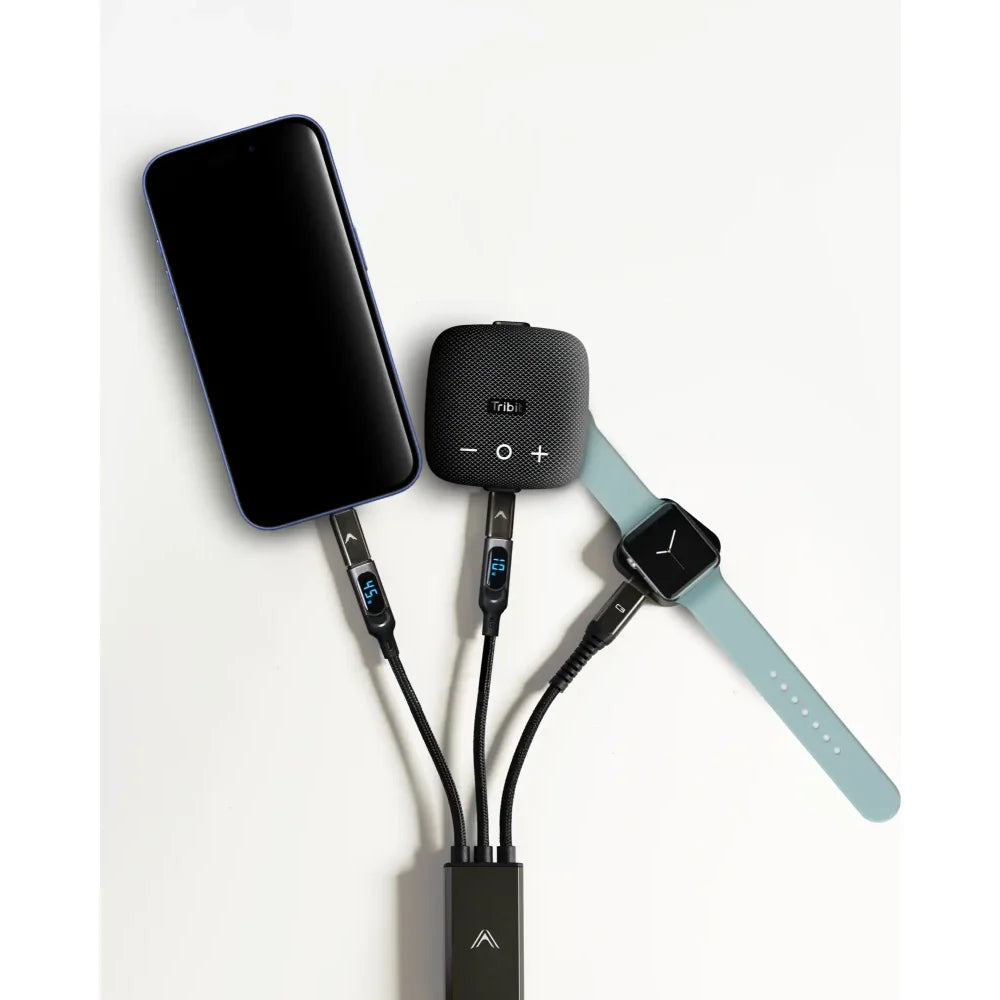 A multi-device charging station with cables connected to a phone, a portable speaker, and a smartwatch.