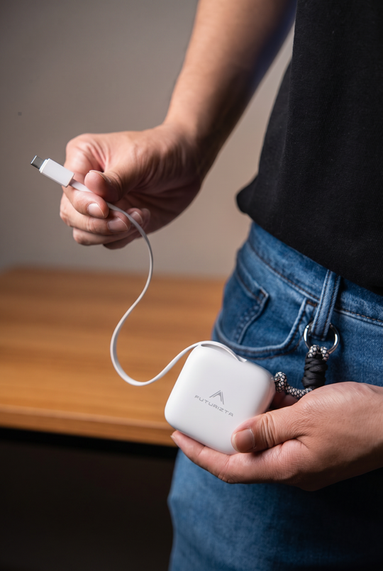 Hand Pulling Built-in Retractable USB-C Cable from Pixy Pop Charger