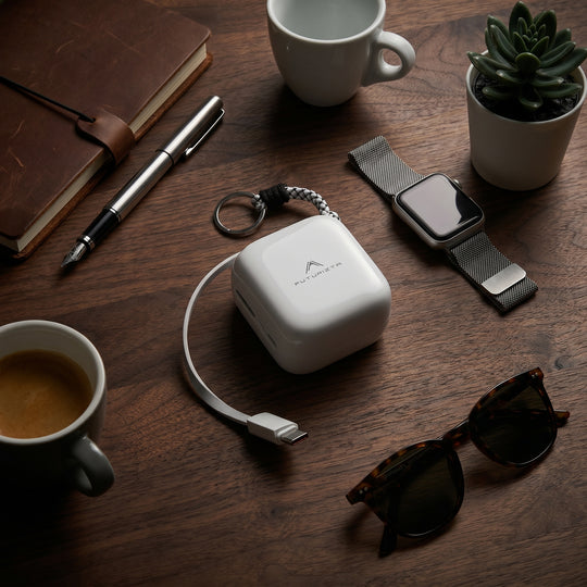Woman Seated Charging Device with Pixy Pop USB-C Powerbank