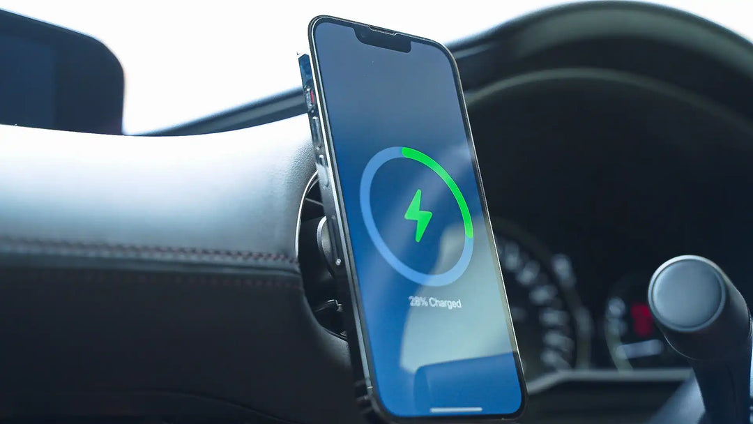 Charging smartphone mounted in car.
